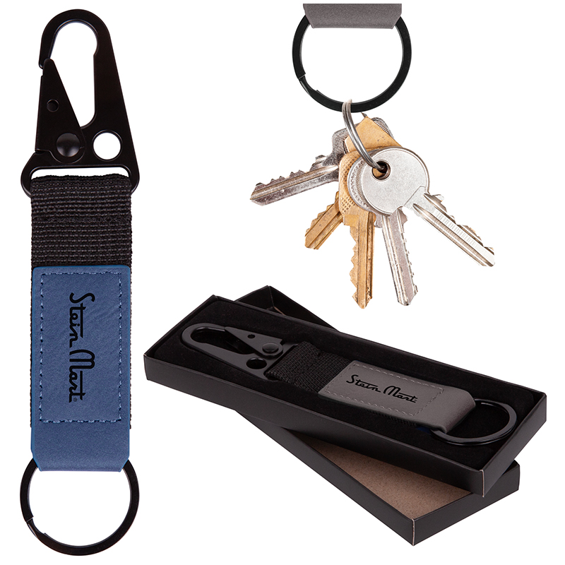The Boise Heavy Duty Key Chain - Forget flimsy. Meet the StrongMan: heavy-duty webbing wrapped in buttery faux leatherette, built to conquer and compliment. A gunmetal spring clip grips tight, while the 32mm black ring holds your keys snugly. Hook it, loop it, clip it—you're in control.