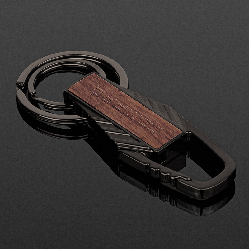 Silverlake Wood Key Chain - Forget boring keys; make a statement. Silverlake Wood Key Chain pairs sleek gunmetal with stunning Rosewood, built to last with dual o-rings and a handy carabiner clip. Stylish, secure, and statement-making—elevate your everyday keychain. Metal is a zinc alloy with gunmetal plating. Key chain features a rosewood in a clear finish. A carabiner clip hooks your keys onto bags, belts, or loops with ease. Dual o-rings: 35mm and 25mm split rings, also with gunmetal plating. Gift box included.